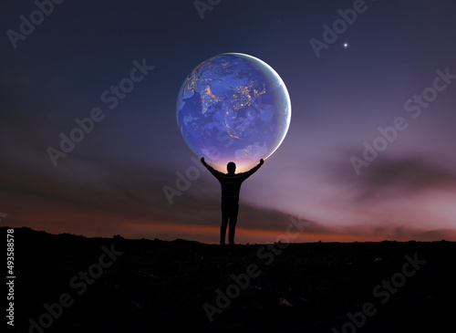 Fototapeta Naklejka Na Ścianę i Meble -  Earth in man hands. World Day. Energy saving, world peace, Man Power. Elements of this image furnished by NASA.	