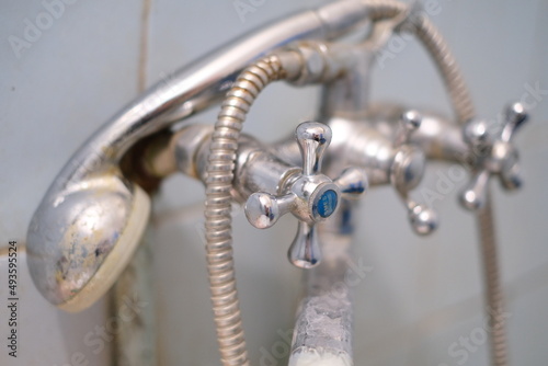 Selective focus, old rusty dirty plumbing in the bathroom close-up