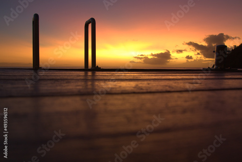 Long time exposure shot taken from ground level on a pontoon in Anses d’Arlet, jewel village sit on Caribbean Sea in Martinique island
