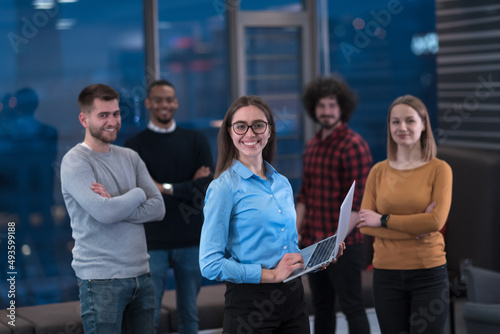 Portrait of successful creative business team looking at camera and smiling. Diverse business people standing together at startup. Selective focus 