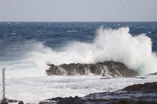 Wave breaking against the shore. El Confital. La Isleta Protected Landscape. Las Palmas de Gran Canaria. Gran Canaria. Canary Islands. Spain.