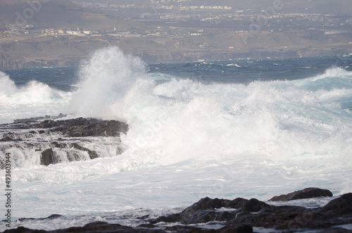 Fototapeta Naklejka Na Ścianę i Meble -  Waves breaking against the shore. El Confital. La Isleta Protected Landscape. Las Palmas de Gran Canaria. Gran Canaria. Canary Islands. Spain.