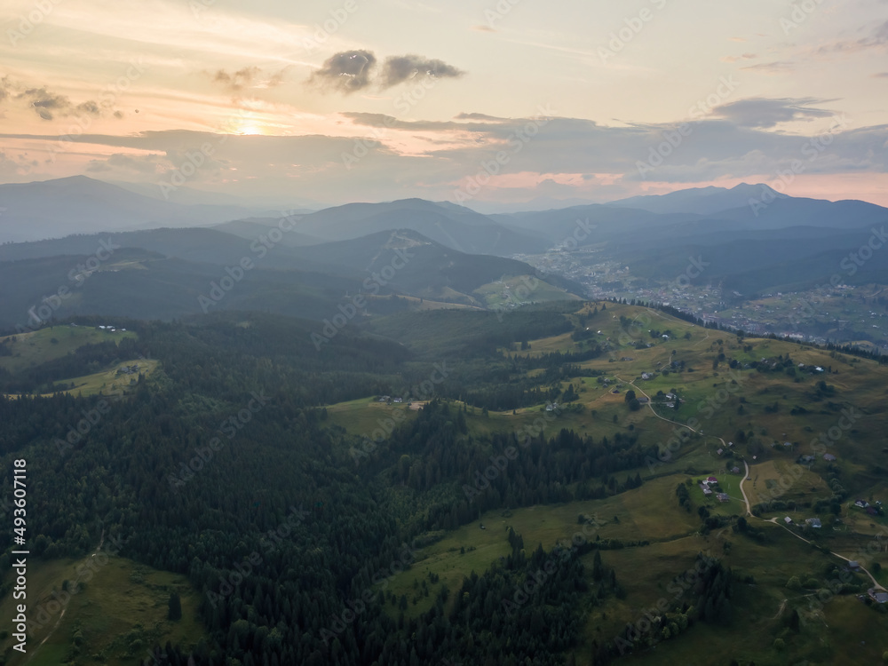 Sunset over the mountains in the Ukrainian Carpathians. Evening. Aerial drone view.