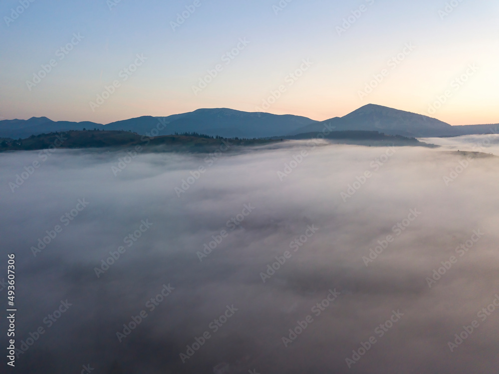 Morning fog in the Ukrainian Carpathians. Aerial drone view. Morning fog in the Ukrainian Carpathians. Aerial drone view.