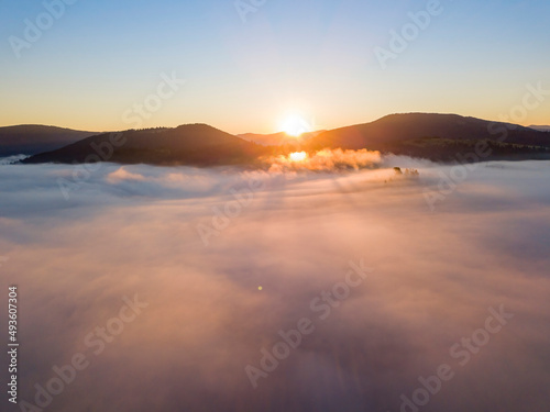 Sunrise over the fog in the Ukrainian Carpathians. Aerial drone view. © Sergey