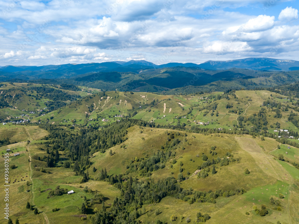 Green mountains of Ukrainian Carpathians in summer. Coniferous trees on the slopes. Aerial drone view. Green mountains of Ukrainian Carpathians in summer. Coniferous trees on the slopes. Aerial drone view.