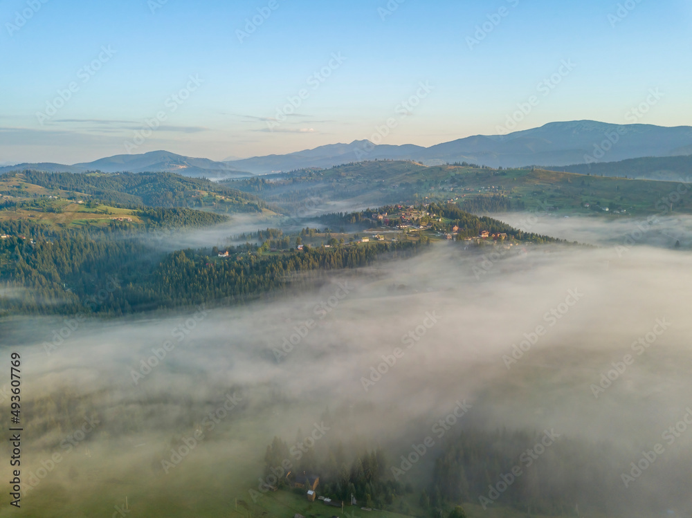 Morning fog in the Ukrainian Carpathians. Aerial drone view. Morning fog in the Ukrainian Carpathians. Aerial drone view.