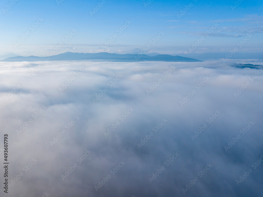 Morning fog in the Ukrainian Carpathians. Aerial drone view.