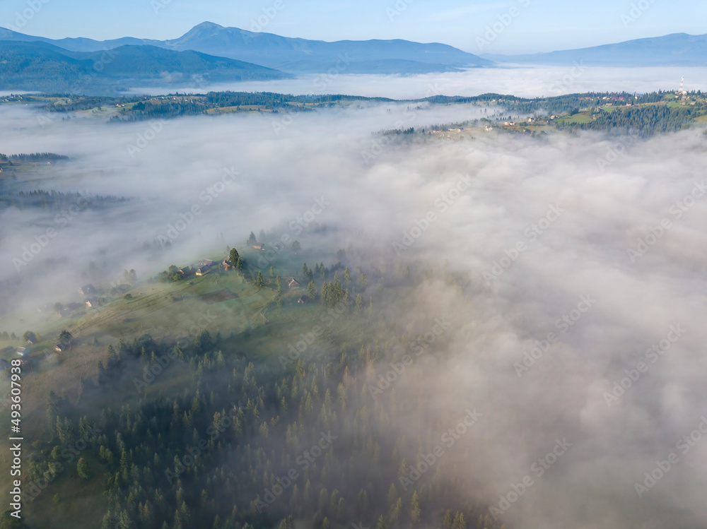 Morning fog in the Ukrainian Carpathians. Aerial drone view.