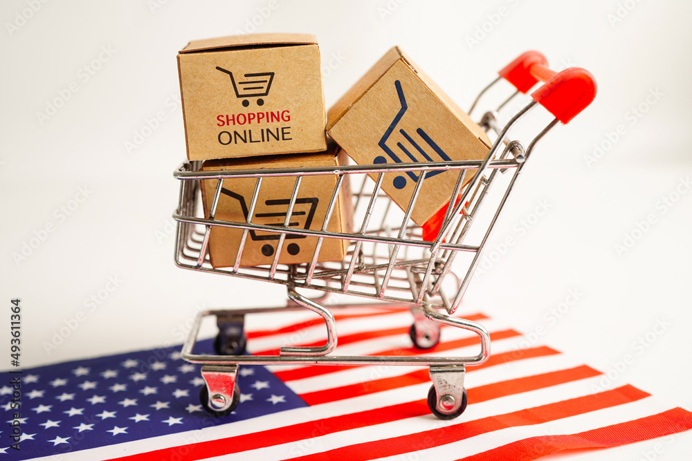 Online shopping, Shopping cart box on USA America flag, import export, finance commerce.