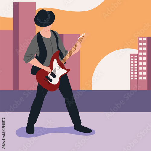 musician playing guitar in the street