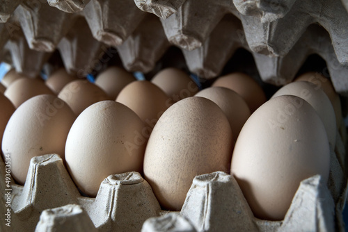 eggs in a cardboard box in the kitchen in the daylight
