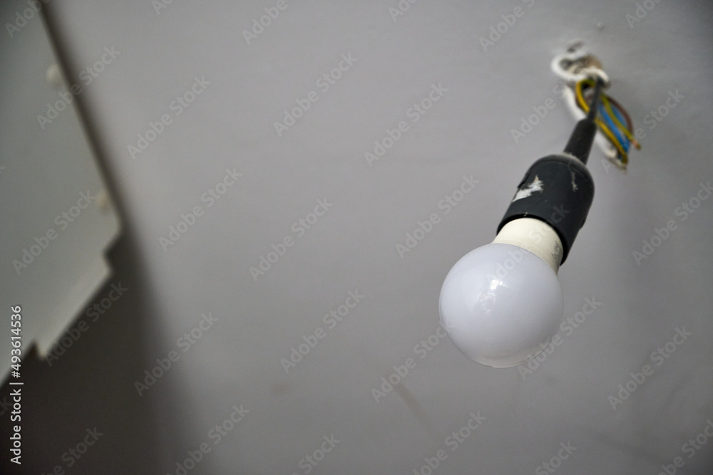 bulb in the housing and on the cable in the ceiling during renovation