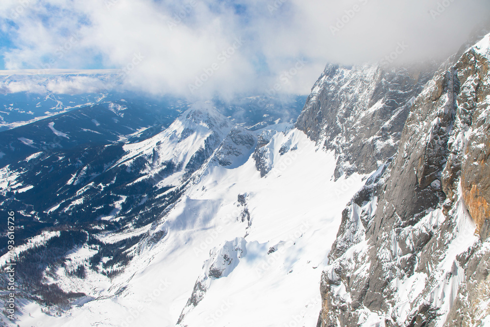 The snowy winter panorama of the Dachstein Alps. The Dachstein is the highest mountain in Upper Austria, Styria. Eternal ice in the Alps. Winter vacation