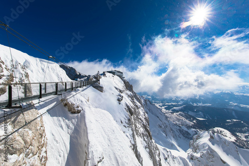 Austrias highest suspension bridge in the austrian Alps. Skywalk on Dachstein. Schladming, Styria, Austria Spectacular winter landscape and breathtaking views.