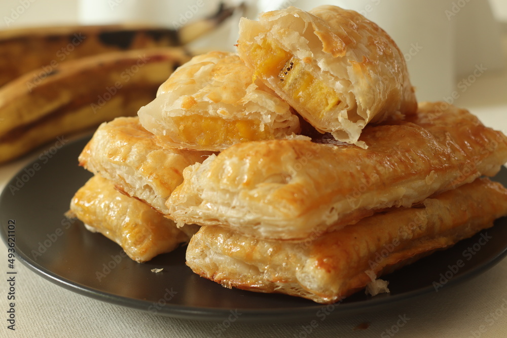 Plantain puff. Ripe plantain slices wrapped in a puff pastry sheets and baked until crisp