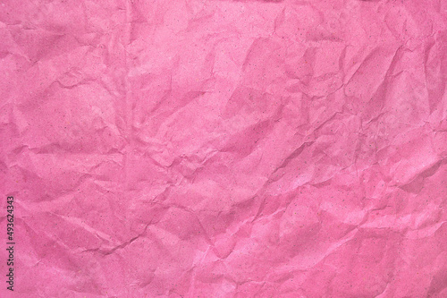 Pink crumpled recycle paper texture, Red paper sheet or page. Office document background, copy space for add text. Delicate fond for video, article and advertising about creativity, art or cosmetics