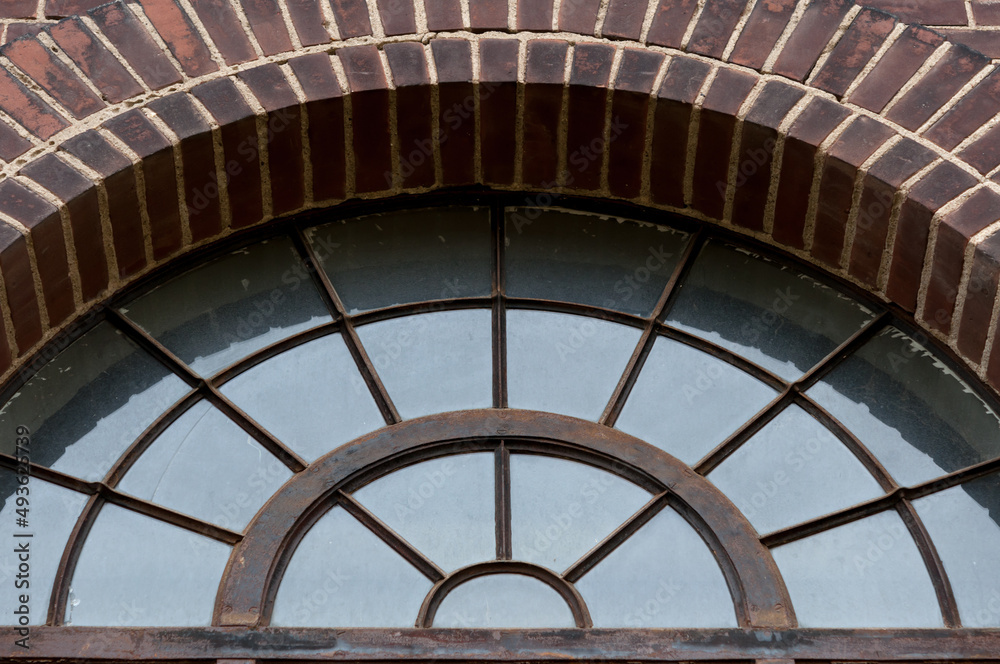 Fototapeta premium lunette window and brickwork