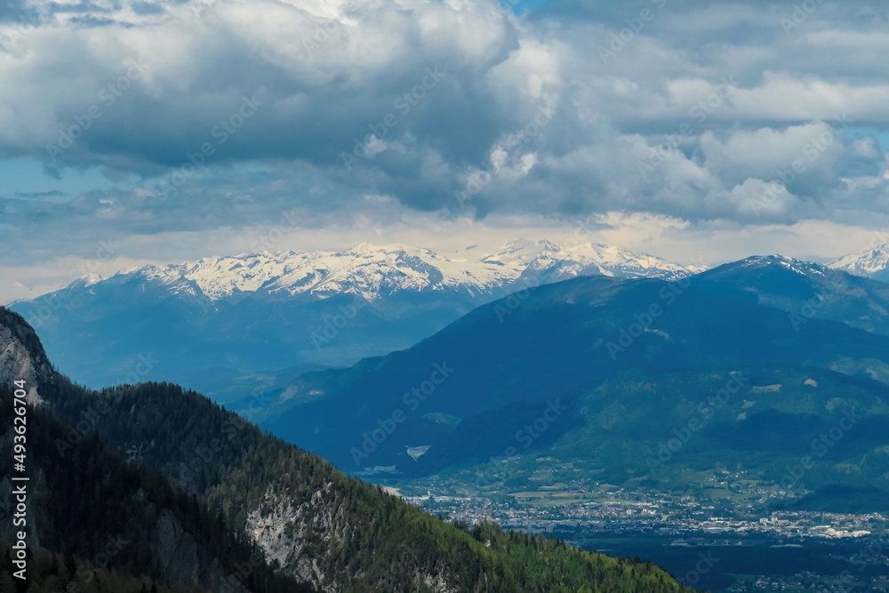 Obraz premium Mountain peak of Hahnkogel (Klek) with panoramic view in spring on the Karawanks, Carinthia, Austria. Borders Austria, Slovenia, Italy. Hohe Tauern Mountain Range. Alpine meadows