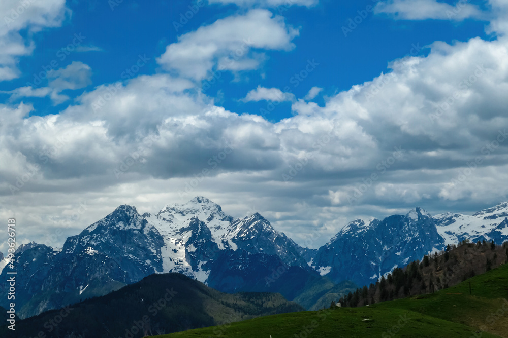 Panoramic view in spring from Frauenkogel on mount Triglav in the Julian Alps, Jesenice, Slovenia. Border Austria, Italy, Slovenia. Triglav National Park. Jesenice in the Upper Drava valley. Summit Panoramic view in spring from Frauenkogel on mount Triglav in the Julian Alps, Jesenice, Slovenia. Border Austria, Italy, Slovenia. Triglav National Park. Jesenice in the Upper Drava valley. Summit