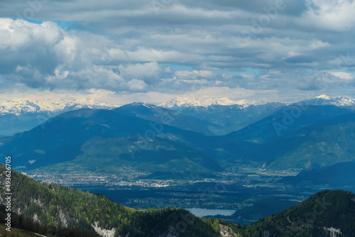 Mountain peak of Hahnkogel (Klek) with panoramic view in spring on the Karawanks, Carinthia, Austria. Borders Austria, Slovenia, Italy. Hohe Tauern Mountain Range. Alpine meadows