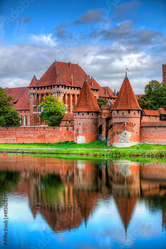 Malbork Castle by the River Nogat, Poland, on a Calm Day