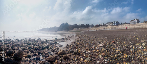 Seascape of Dawlish beach at low tide with fog