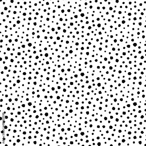 Hand drawn vector illustration of random black dot pattern on white background. 