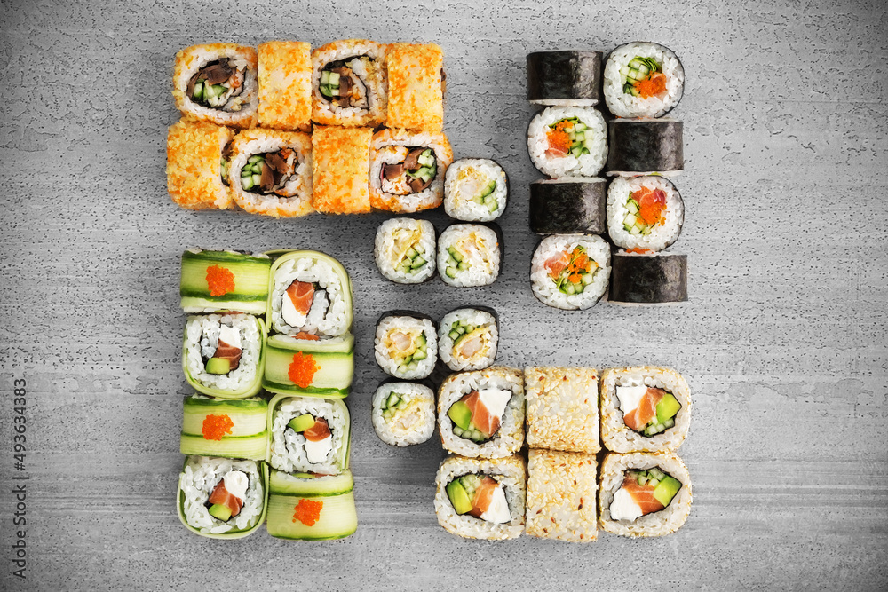 Big sushi set of different rolls. Photo of food on a white background.