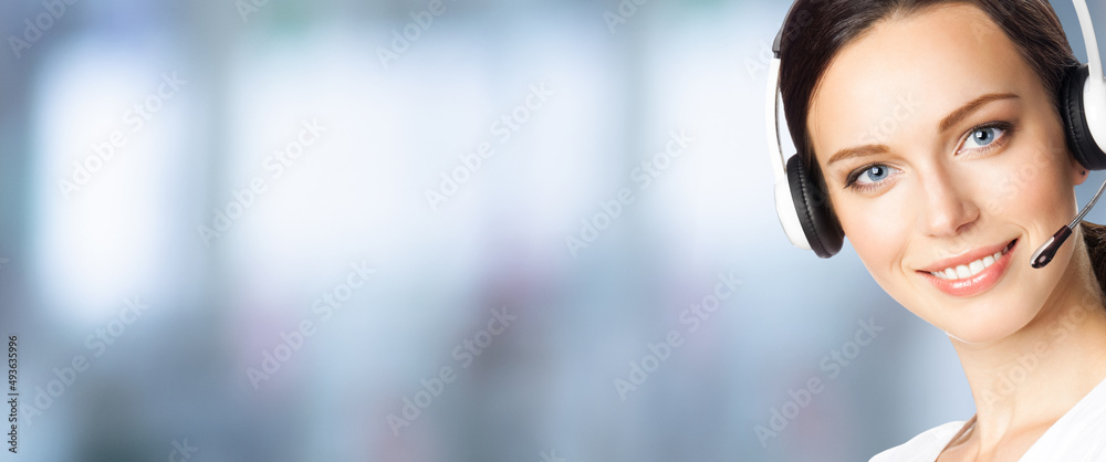 Call center help line service. Studio portrait image of customer support phone sales operator in headset, indoors. Brunette business woman. Adviser. Call center help line service. Studio portrait image of customer support phone sales operator in headset, indoors. Brunette business woman. Adviser.