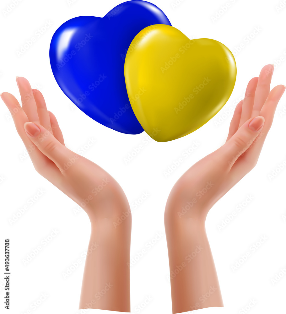 Hands holding yellow and blue hearts of Ukraine