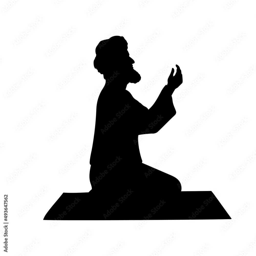 Silhouette of muslim man praying