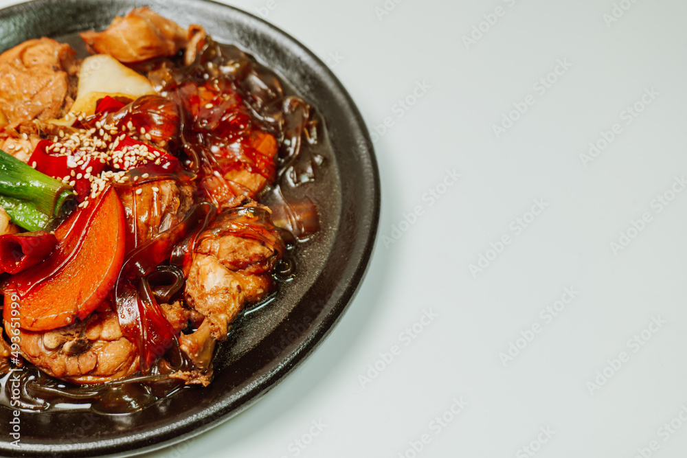 Andongjjimdak, Korean Braised Chicken : To make this dish, chicken is cut into pieces and braised with carrot, potato, and other vegetables, along with a soy sauce-based seasoning. Glass noodles can b Andongjjimdak, Korean Braised Chicken : To make this dish, chicken is cut into pieces and braised with carrot, potato, and other vegetables, along with a soy sauce-based seasoning. Glass noodles can b
