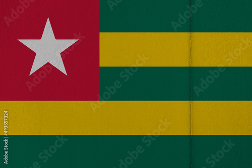 Patriotic wooden background in colors of national flag. Togo