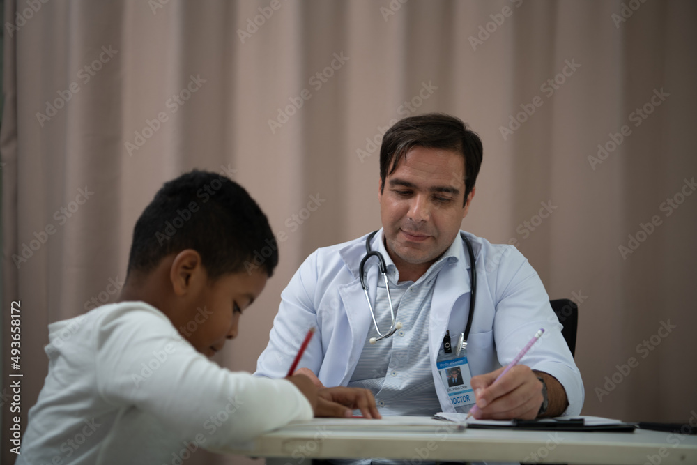 A doctor at an international hospital Trying to check up of a mischievous child A doctor at an international hospital Trying to check up of a mischievous child