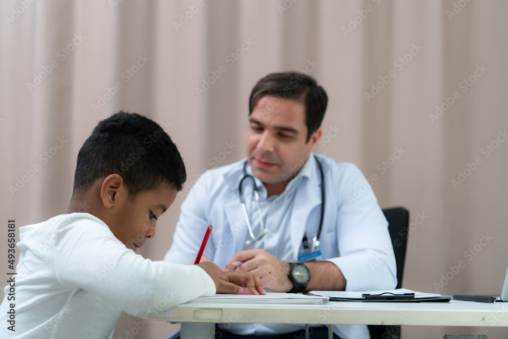 A doctor at an international hospital Trying to check up of a mischievous child A doctor at an international hospital Trying to check up of a mischievous child