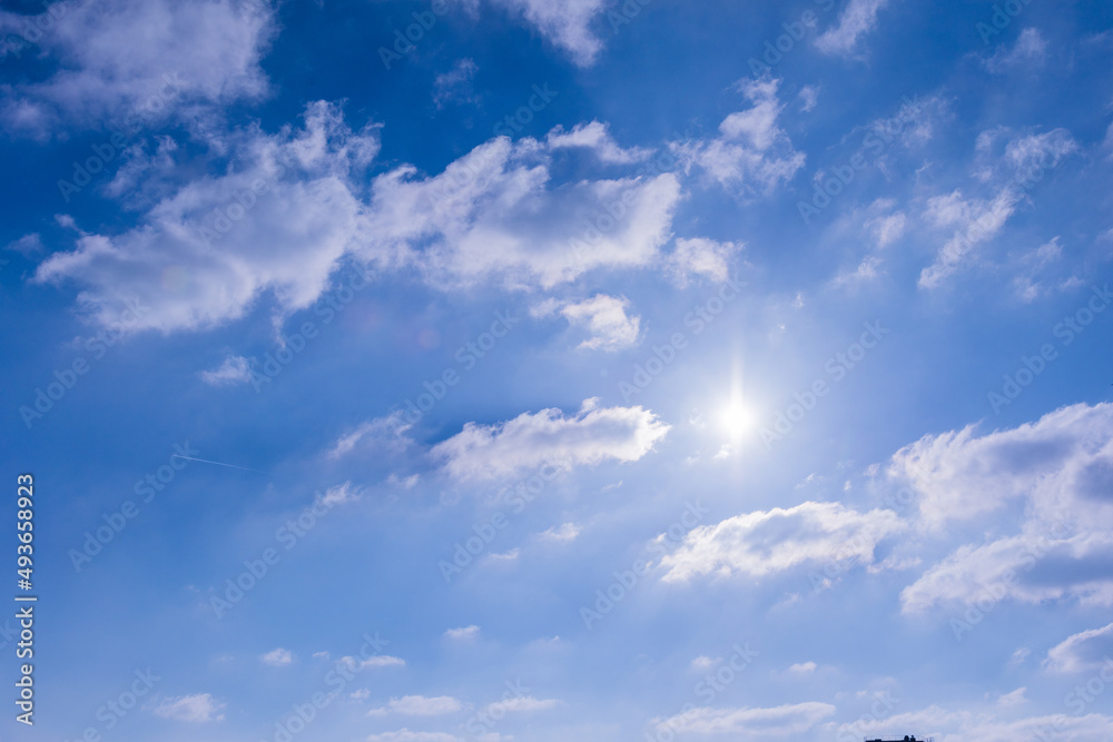 blue sky with sun and clouds blue sky with sun and clouds