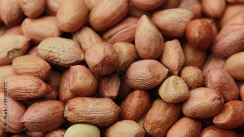 Salted Roasted Peanuts, Peeled raw peanuts are in a plastic cup, Healthy content, Copy space, top view.
