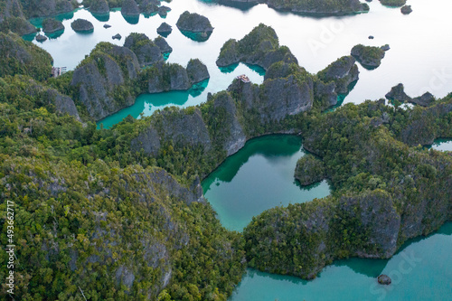 The beautiful limestone islands in Raja Ampat, Indonesia, have eroded into karst mazes. This tropical region is known as the heart of the Coral Triangle due to its extraordinary marine biodiversity.