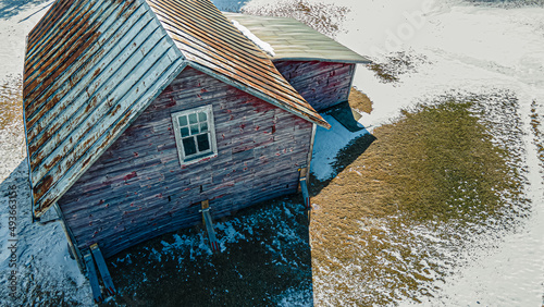 Collapsing red buiilding in winter photo