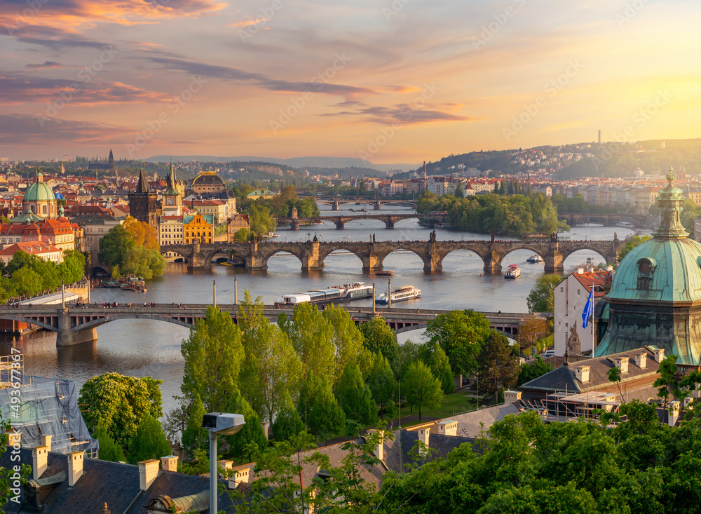 Classic Prague cityscape with bridges over Vltava river at sunset, Czech Republic