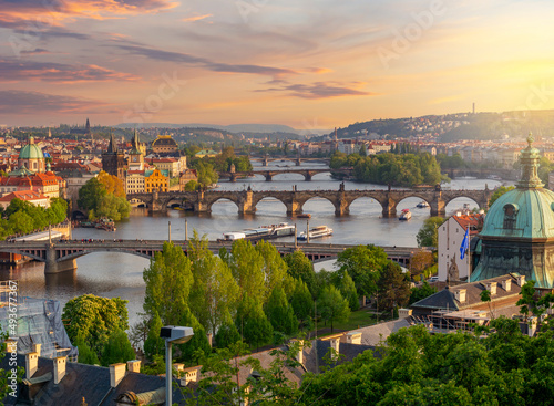 Photography Classic Prague cityscape with bridges over Vltava river at sunset, Czech Republi
