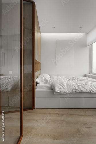 bedroom with glass doors in loft apartment