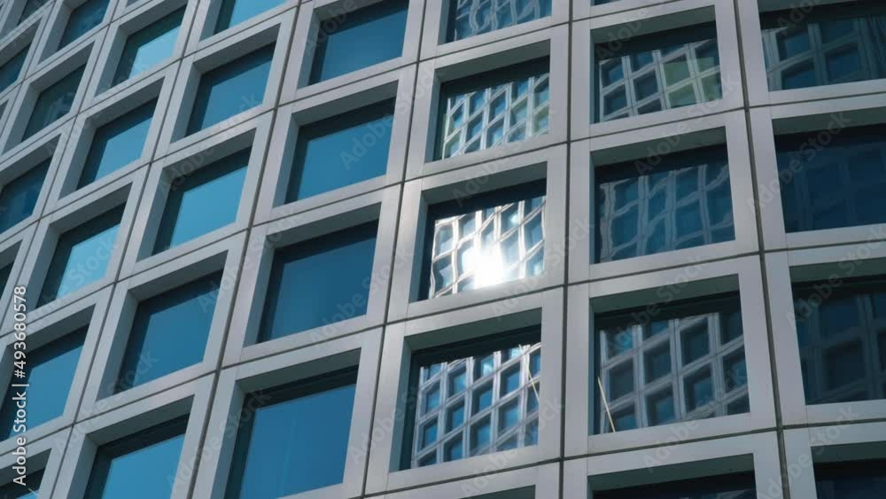 Skyscraper reflects in the facade of next standing building in the financial district. Slow motion. Skyscraper reflects in the facade of next standing building in the financial district. Slow motion.