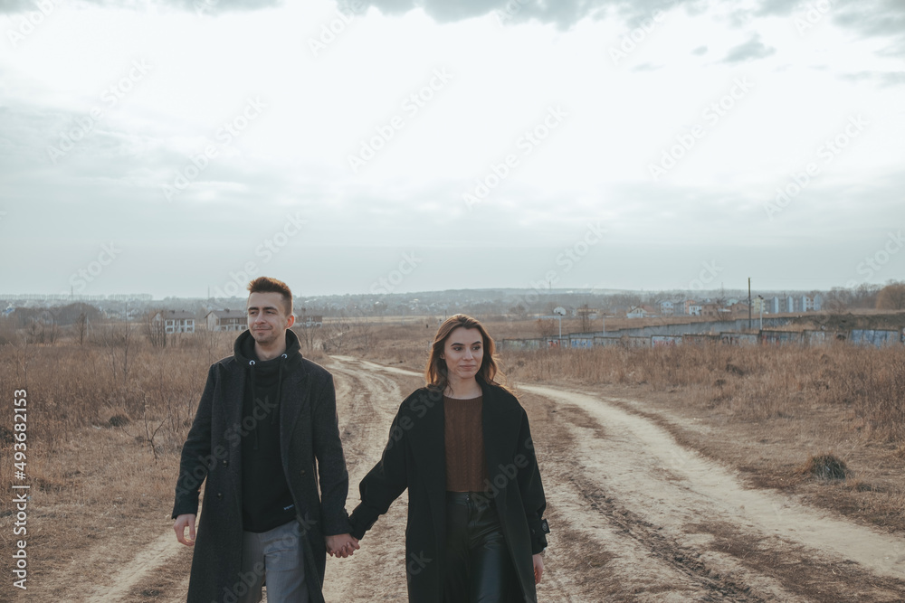 Naklejka premium Young loving couple with coffee on ukrainian nature background