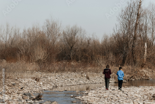children by the river