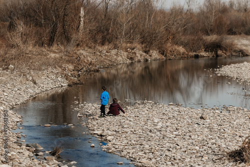 children by the river