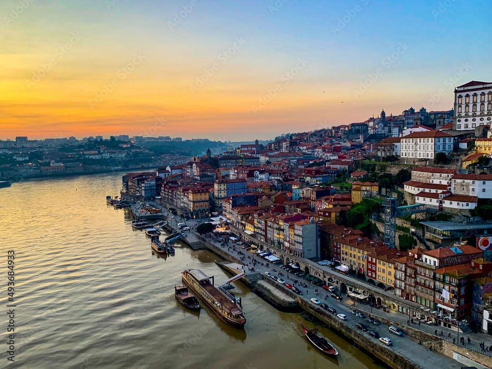 Porto view from Ponte Luis I bridge. Ribeira charming area view from bridge. Douro river. Old medieval town in northern Portugal. Down town. Sunset twilight in city. Rooftop view.