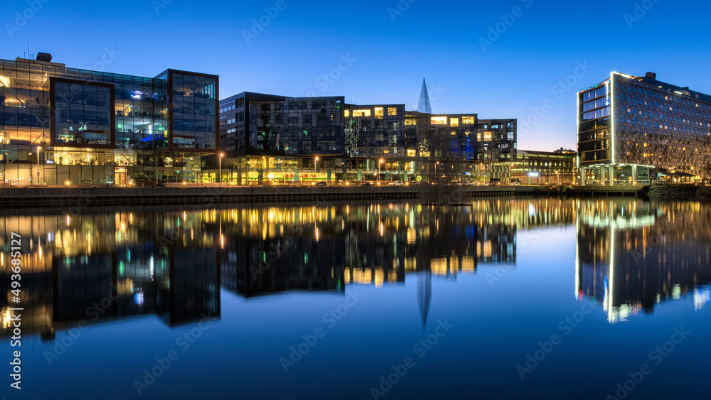 Modern buildings reflected in water at Lindholmen science park gothenburg,sweden