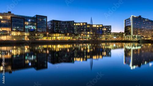 Modern buildings reflected in water at Lindholmen science park gothenburg,sweden